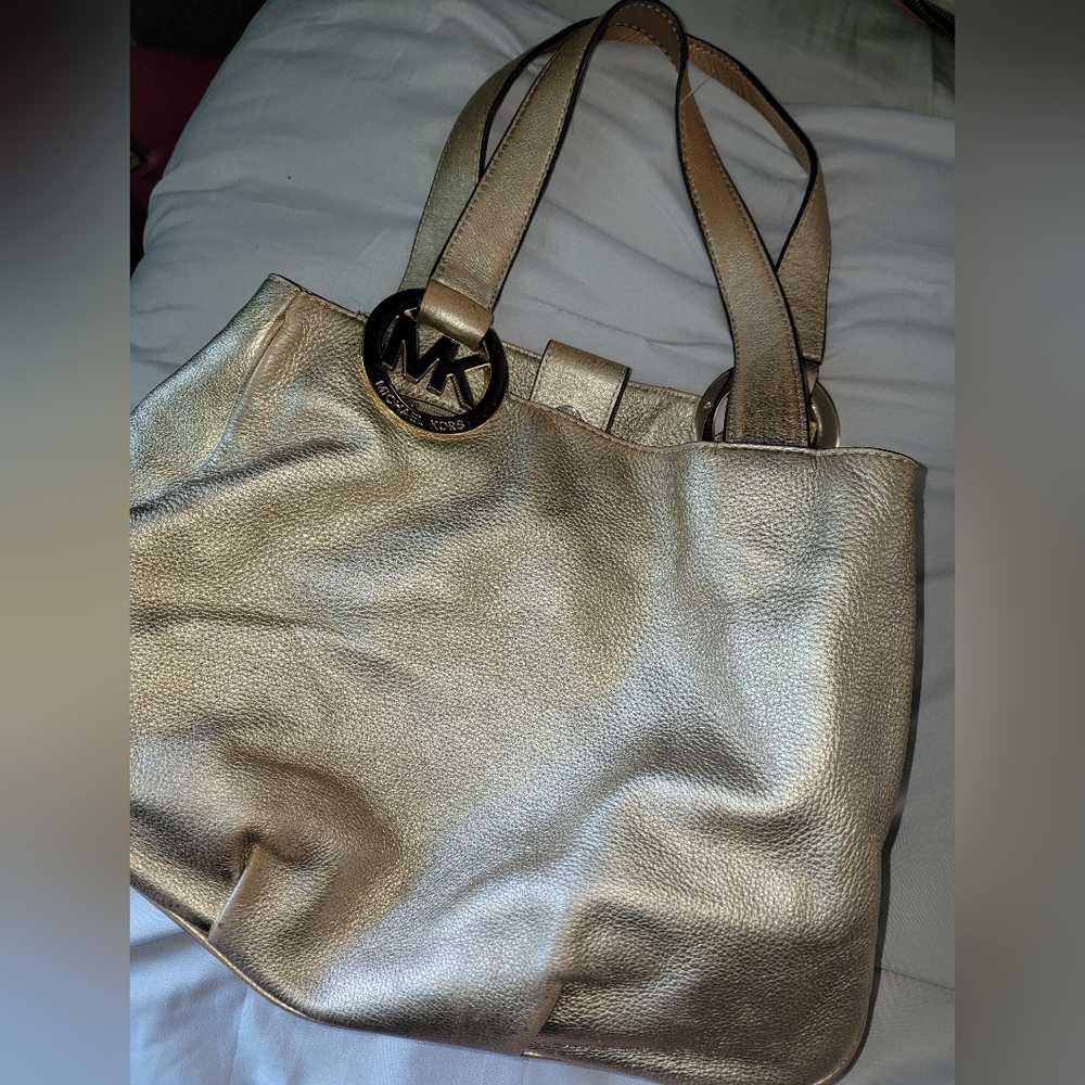 Gold Michael Kors purse and wallet